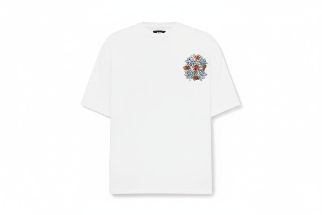 White t-shirt with floral embroidery on a light gray background